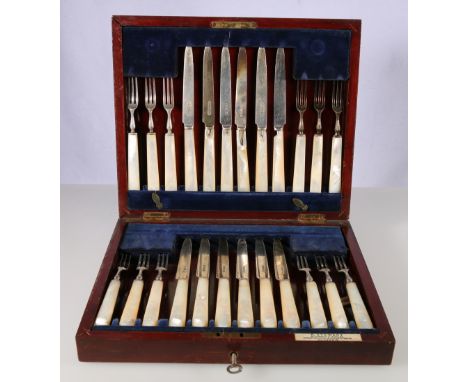 Cased set of twelve dessert knives and forks with mother-of-pearl handles and silver blades and tines by Robert Stewart 1919 