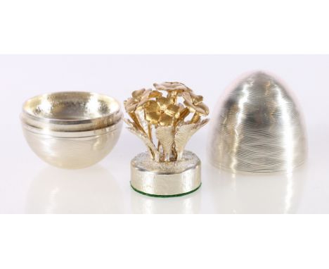 Elizabeth II silver 'surprise' egg containing floral posy in the manner of Stuart Devlin, with makers marks NP for Nicholas P