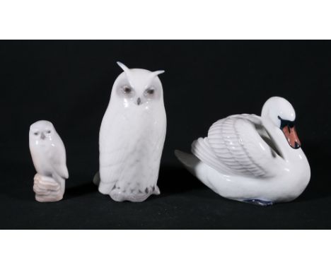 Three Royal Copenhagen models including swan (359), owl (155) and owl (1741), 11cm tall, 15cm tall and 8cm tall respectively.