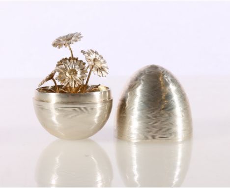 Elizabeth II silver 'surprise' egg containing floral posy in the manner of Stuart Devlin, with makers marks NP for Nicholas P