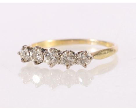Unhallmarked yellow metal five stone diamond ring, each stone approximately 0.15ct, size R, 2.2g. 