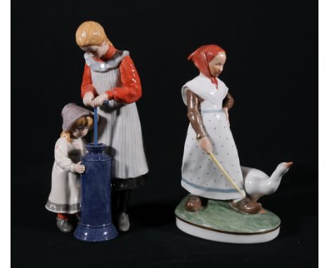 Two Royal Copenhagen figure groups, one of a girl with goose, numbered 528 to base and the other two girls at pump, limited e