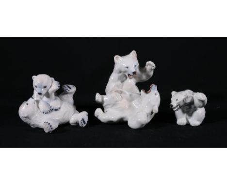 Three Royal Copenhagen polar bear models including fighting bears 085, playing bears 324 and knarling bear 233, 15cm, 10cm an