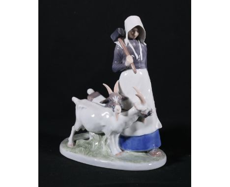 Royal Copenhagen figure of a female holding sledgehammer with two goats, blue mark to base, number 069, 23cm tall.CONDITION R