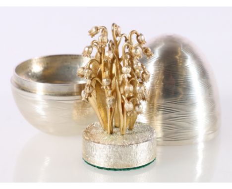 Elizabeth II silver 'surprise' egg containing floral posy (possibly bluebells) in the manner of Stuart Devlin, with makers ma