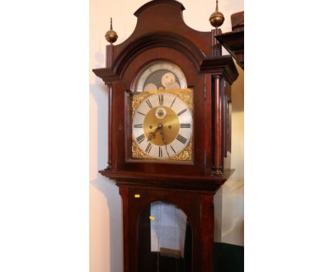 Mahogany cased longcase grandfather clock having arched top brass dial with rolling moon phase and silvered Roman numeral cha