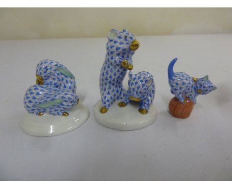 Three Herend fishnet figurines a pair of mice, a pair of rabbits, and a cat playing on the ball of twine