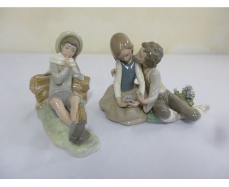 Lladro figural group Sweethearts and a figurine of a recumbent boy