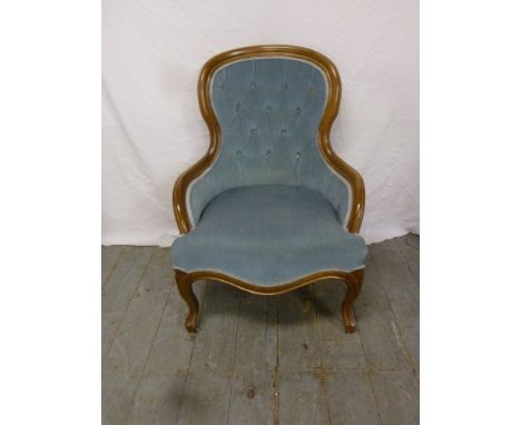 A mahogany button back upholstered ladies chair on scroll legs