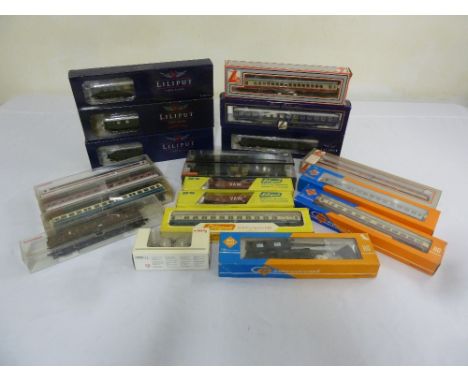 A quantity of HO gauge coaches and rolling stock to include Lima, Roco, Liliput, Fleischmann and Marklin in original packagin