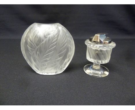 A Lalique table lighter, vase form on circular base and a Lalique small leaf vase