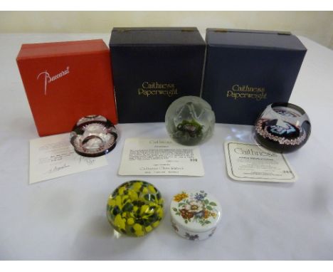 Four paperweights to include Baccarat and Caithness with original packaging and an enamel circular trinket box and cover