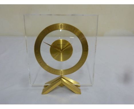 Jaeger Le Coultre 8 day mantle clock, glass face with gilt metal chapter ring, dial and stand
