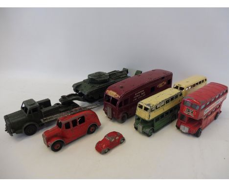 A quantity of playworn Dinky Toys including a British Railways Express horse box, buses etc. also a miniature Schuco VW Beetl