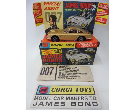 A 1965 Corgi 261 James Bond 007 Aston Martin DB5 in very near to factory fresh condition including a sealed secret envelope c