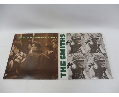 Two The Smiths LPs: Meat is Murder, vinyl appears in EXC condition, cover has some light creasing and The World Won't Listen,