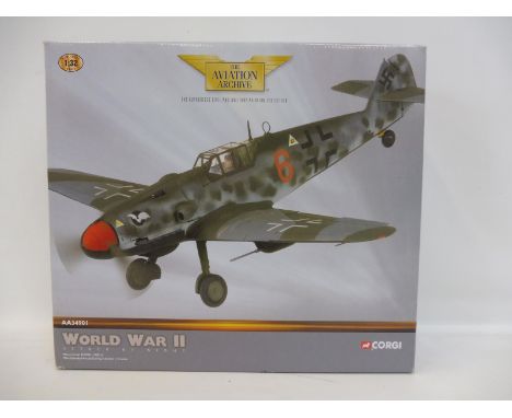 A Corgi Aviation Archive 1/32 scale 'Attack by Night' Messerschmitt 109G, red 6, appears in excellent condition.