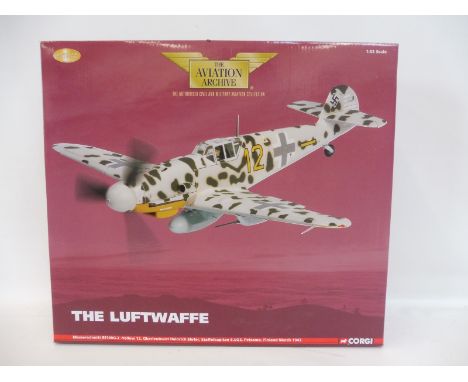 A boxed Corgi Aviation Archive 1/32 scale 'The Luftwaffe' Messerschmitt BF109G-2, yellow 12, appears in excellent condition. 