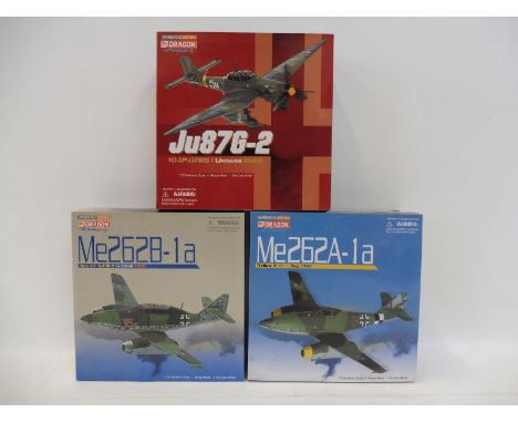 Three 1/72 scale Dragon Warbird Series to include ME262A Yellow 3, appears in excellent condition.