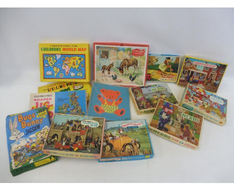 A collection of early jigsaw puzzles many tv related including Camberwick Green, The Magic Roundabout, Trumpton, The Herbs an