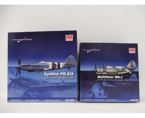 Two HM Hobbymaster models, a 1/72 scale Helldiver Mk.I Fleet Air Arm 1944 and a 1/48 scale Spitfire PRX1X Benson 1944, appear