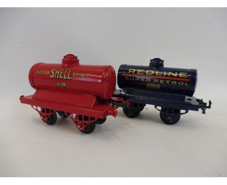 A Hornby O gauge tanker, well restored in Redline livery plus a second, also well restored in Shell livery.