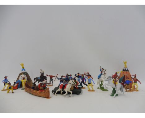 A box of Timpo and Britains Wild West figures, all appear complete with guns and accessories.