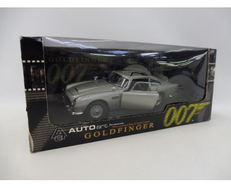 An AutoArt James Bond 007 Aston Martin DB5 model. Considered by many to be one of the finest 1:18 scale recreations of James 