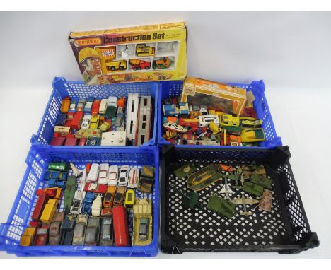 Four trays of die-cast models including Dinky, Corgi, Britains and Matchbox etc. 