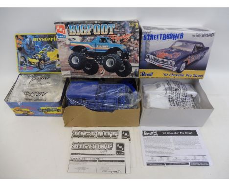 A boxed AMT ERTL 1/25 scale model kit 'Bigfoot' and two others including a limited edition 'Mysterion', Ed Roth.