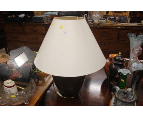 A large pottery brown glazed table lamp and shade 