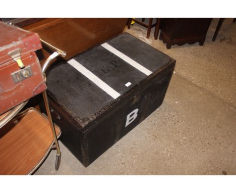 A large black canvas and metal bound travelling trunk initialled with a "B"