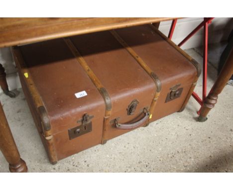 A wooden bound travelling trunk 