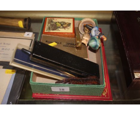 A Queen Elizabeth II commemorative coin; together with a  box containing a Goebel figure, a carved treen snuff box in the for