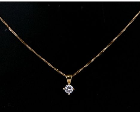 An 18ct gold diamond pendant on fine chain.