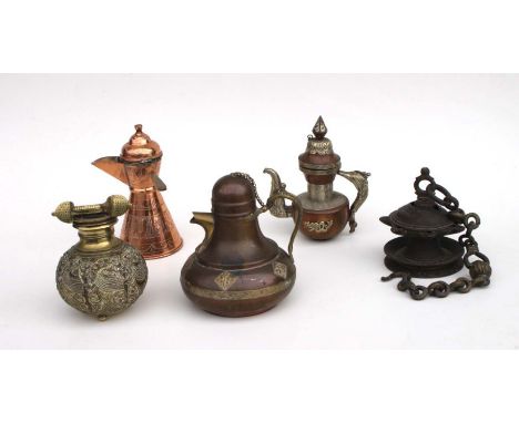 A quantity of Eastern and Asian metalware to include a copper coffee pot; a Sino-Tibetan teapot; a singing bowl and other ite