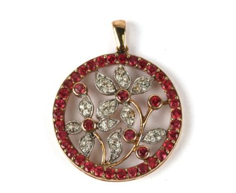 A 9ct gold ruby and diamond pendant decorated with flowers, 4g.