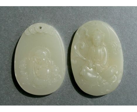 Two carved jade like pendants, each depicting a figure, 6cms and 5.5cms long (3).
