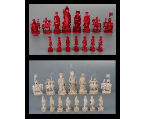 A 19th century Chinese ivory figural chess set, one side stained red, the other side natural, carved as Chinese emperors and 