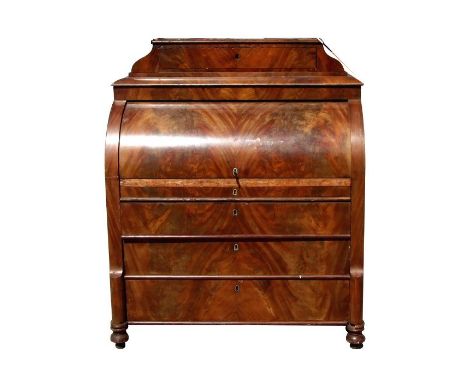 A 19th century continental mahogany cylinder bureau with caddy top and single drawer above the bureau section, with fitted in