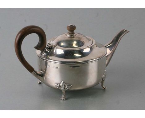 George V Queen Anne style silver teapot of compressed circular form, on oak leaf capped claw feet, Birmingham 1919, 426g, 12c