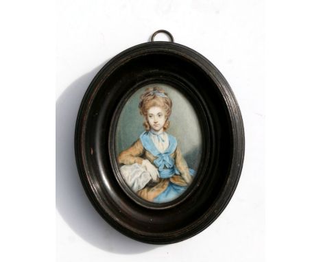 An 18th century portrait miniature on ivory depicting a woman with a blue ribbon in her hair, glazed and in original frame, o