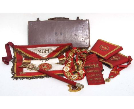 A leather case containing ROAB Buffalo regalia including a heavy ornate collar chain.