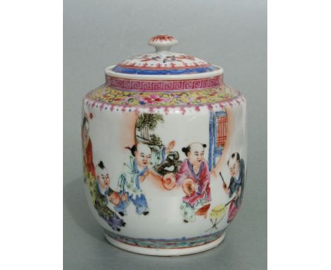 A Chinese Republic period famille rose jar and cover decorated with boys playing, red seal mark to the underside, 15cms high.