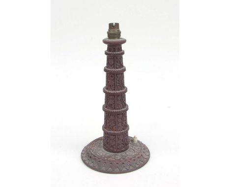 An Indian carved hardwood table lamp, 33cms high.