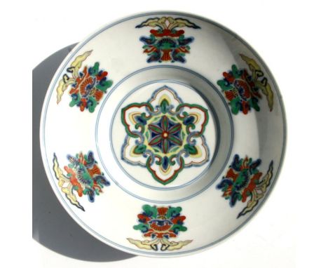 A Chinese Ducai style bowl of shallow flared form decorated with scrolling flowers and foliage, blue seal mark to the undersi