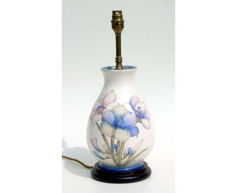 A William Moorcroft table lamp decorated with irises, 28cms high.