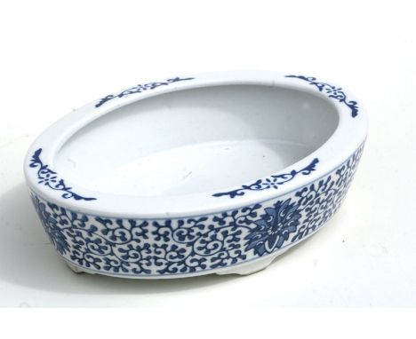 A Chinese blue &amp; white oval dish decorated foliate scrolls with blue seal mark to the underside. 22cm wide