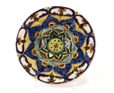 A Della Robbia style pottery shallow dish decorated with stylised flowers, 30cms diameter.Condition ReportCrazing to the glaz