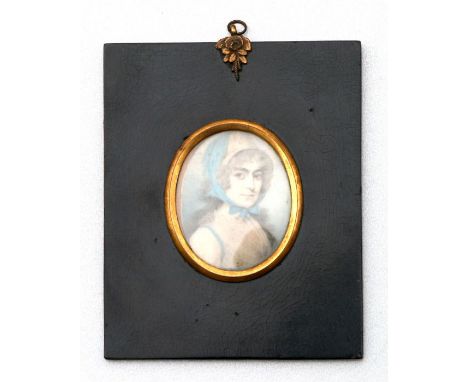 A Regency portrait miniature on ivory depicting a lady wearing a bonnet, inscribed to the back 'Lucretia Haifer, widow of J H